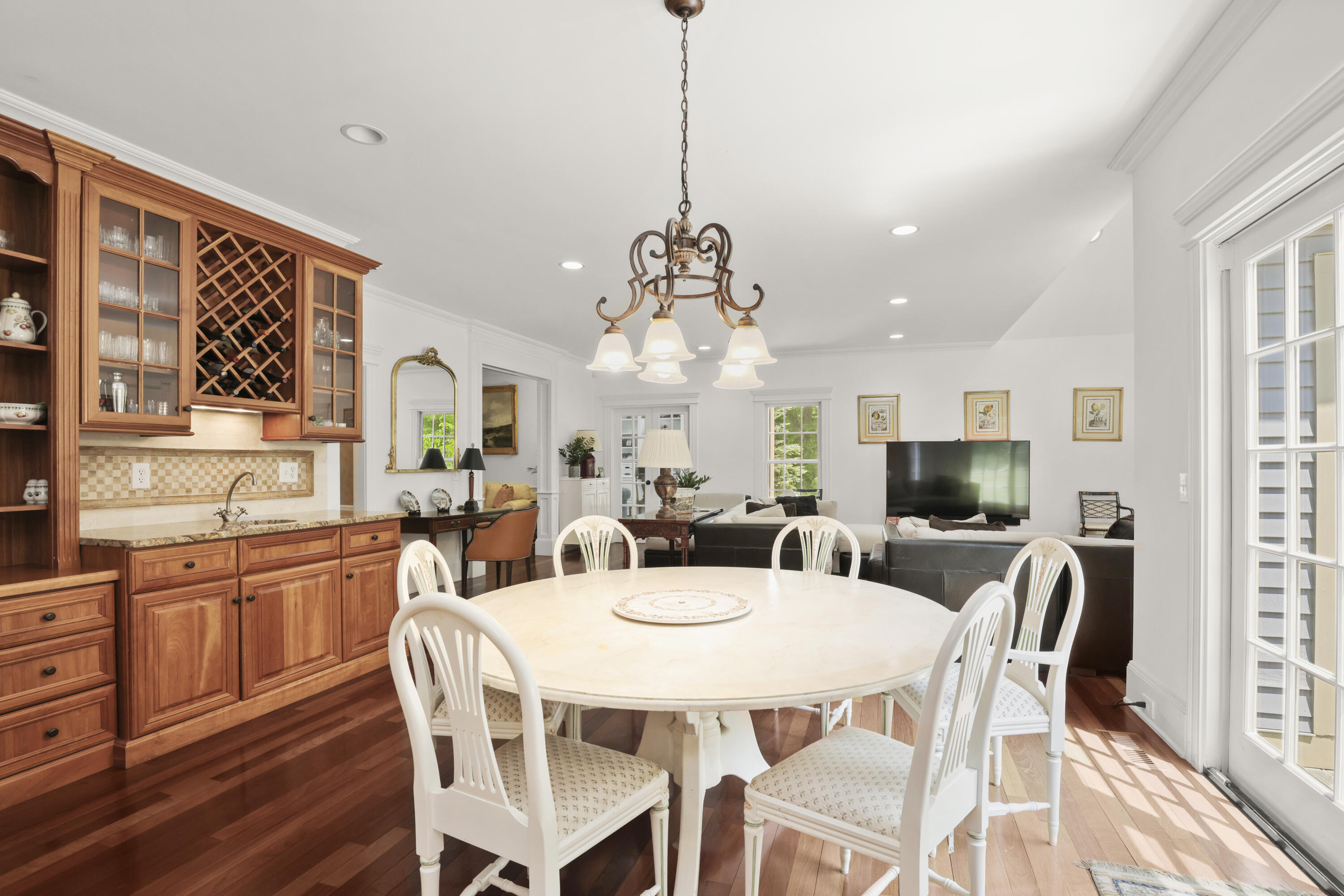 218 Limestone Road Ridgefield, CT 06877 - Photo 19 of 41 a view of a dining room with furniture window and wooden floor