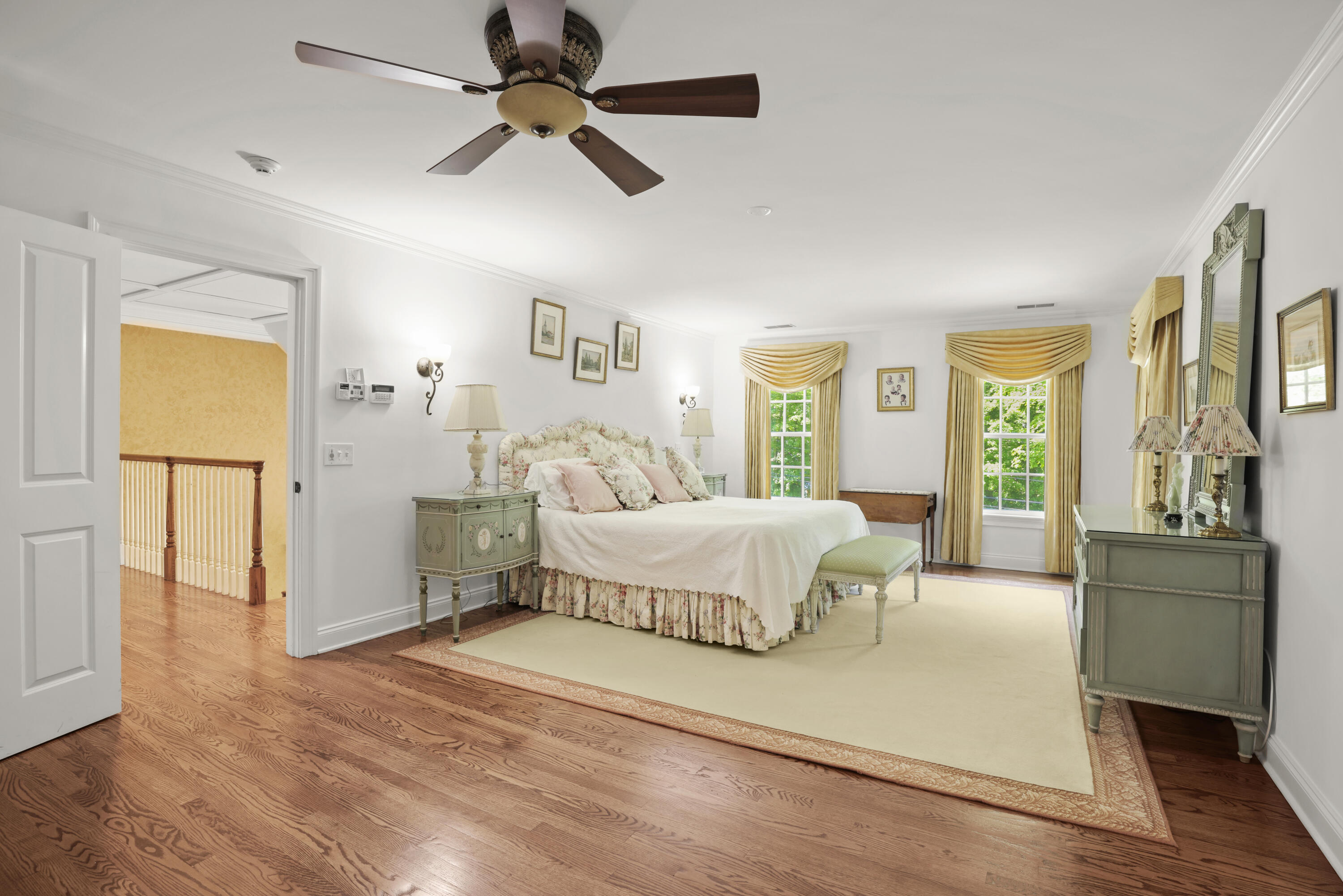 218 Limestone Road Ridgefield, CT 06877 - Photo 29 of 41 a spacious bedroom with a bed and dresser with wooden floor