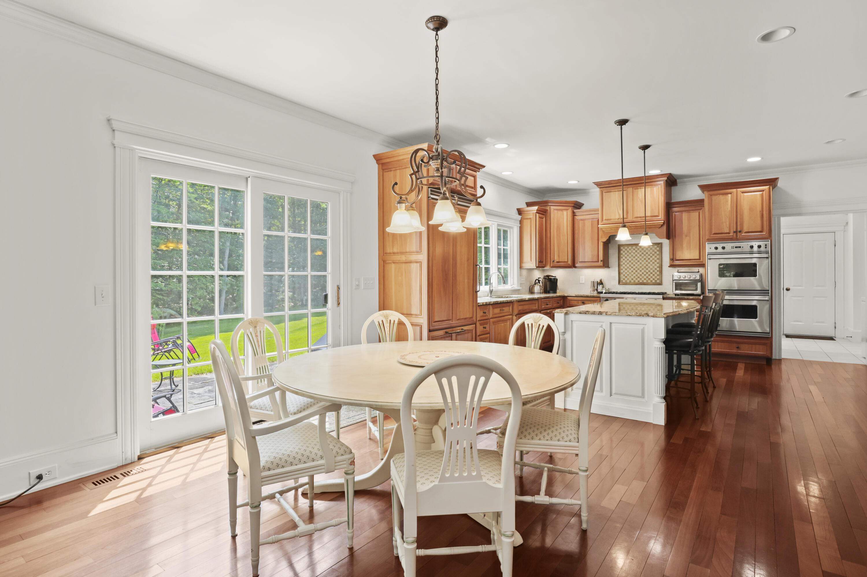 218 Limestone Road Ridgefield, CT 06877 - Photo 10 of 41 a view of a dining room with furniture window and wooden floor