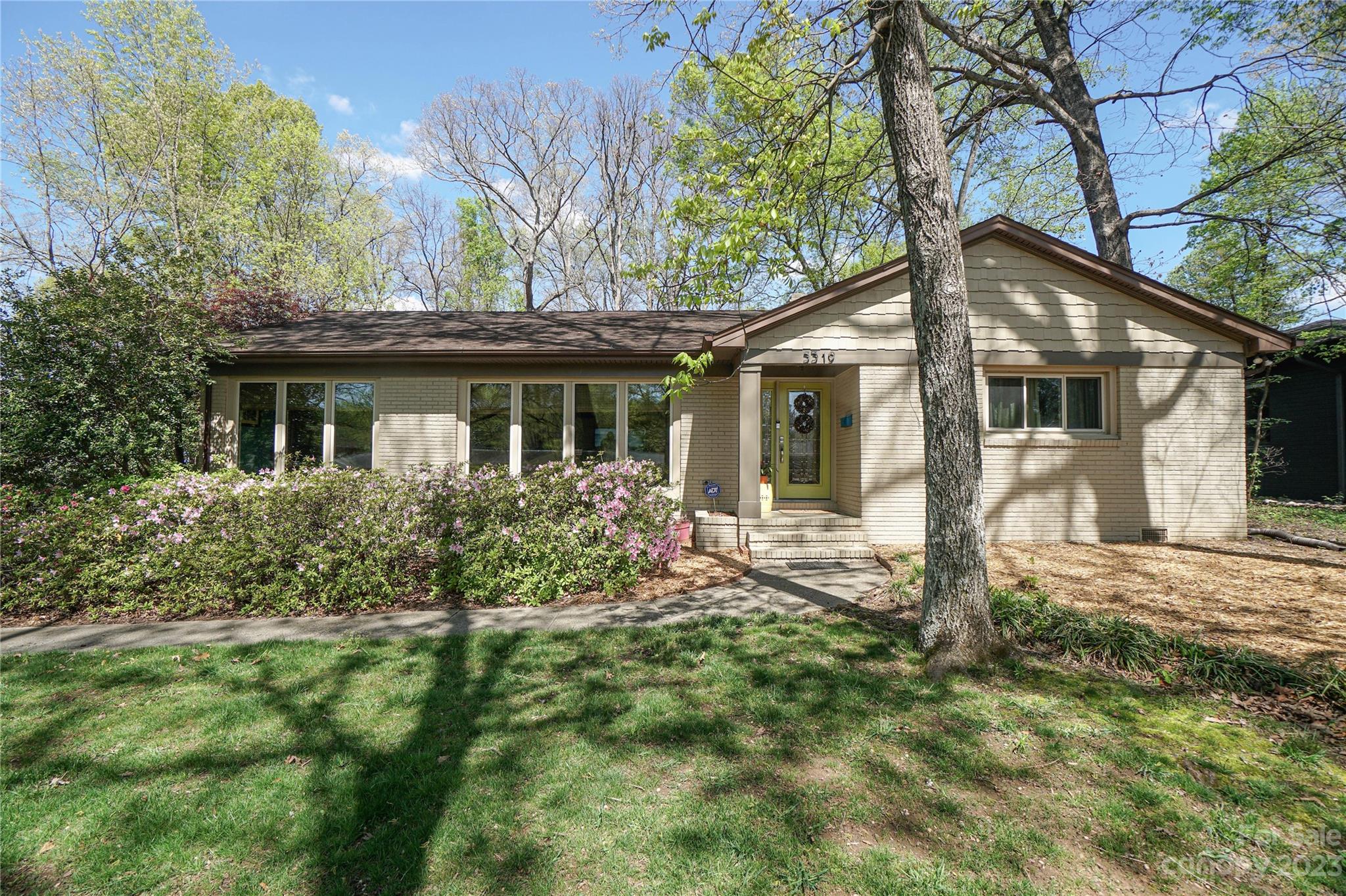 5319 Robinhood Road Charlotte, NC 28211 - Photo 2 of 26 a front view of a house with garden