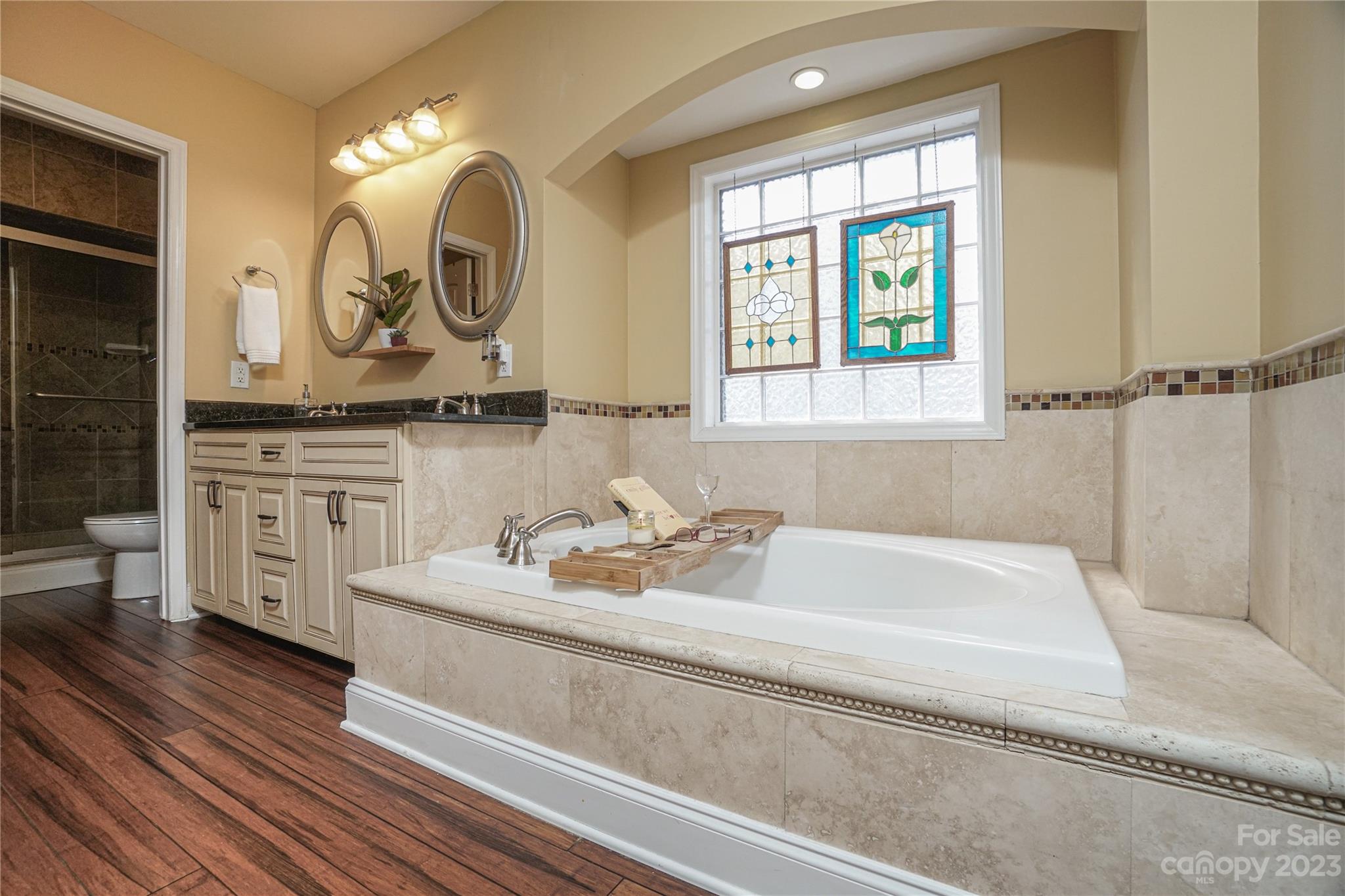 5319 Robinhood Road Charlotte, NC 28211 - Photo 22 of 26 a bathroom with a sink and a mirror