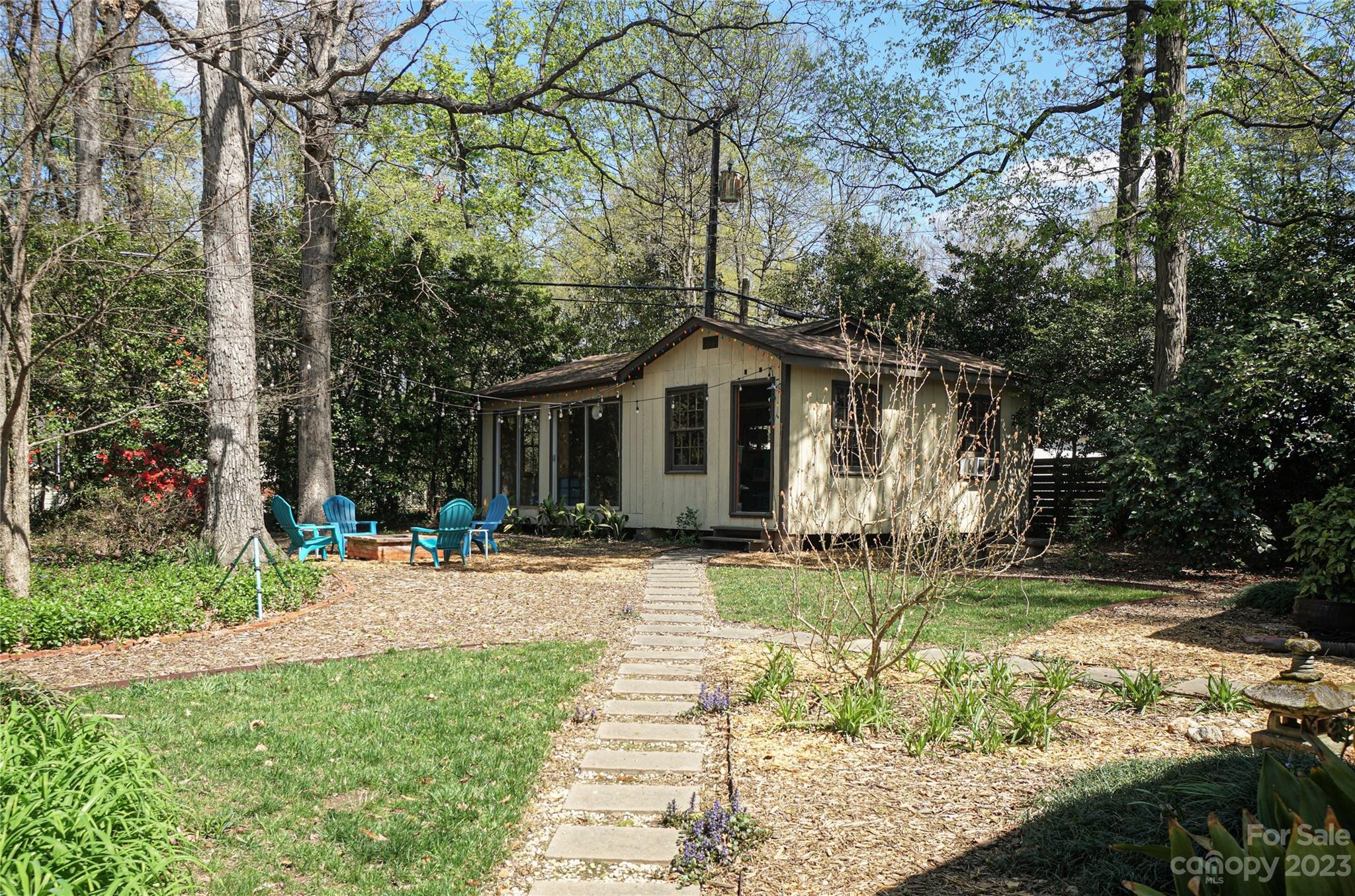 5319 Robinhood Road Charlotte, NC 28211 - Photo 5 of 26 a front view of a house with a yard and porch