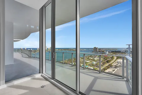 a view of a glass door and a window