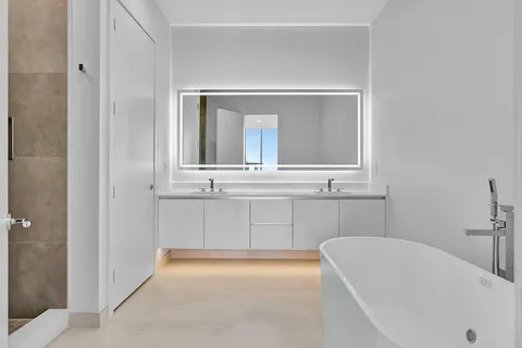 a bathroom with a bathtub and a sink