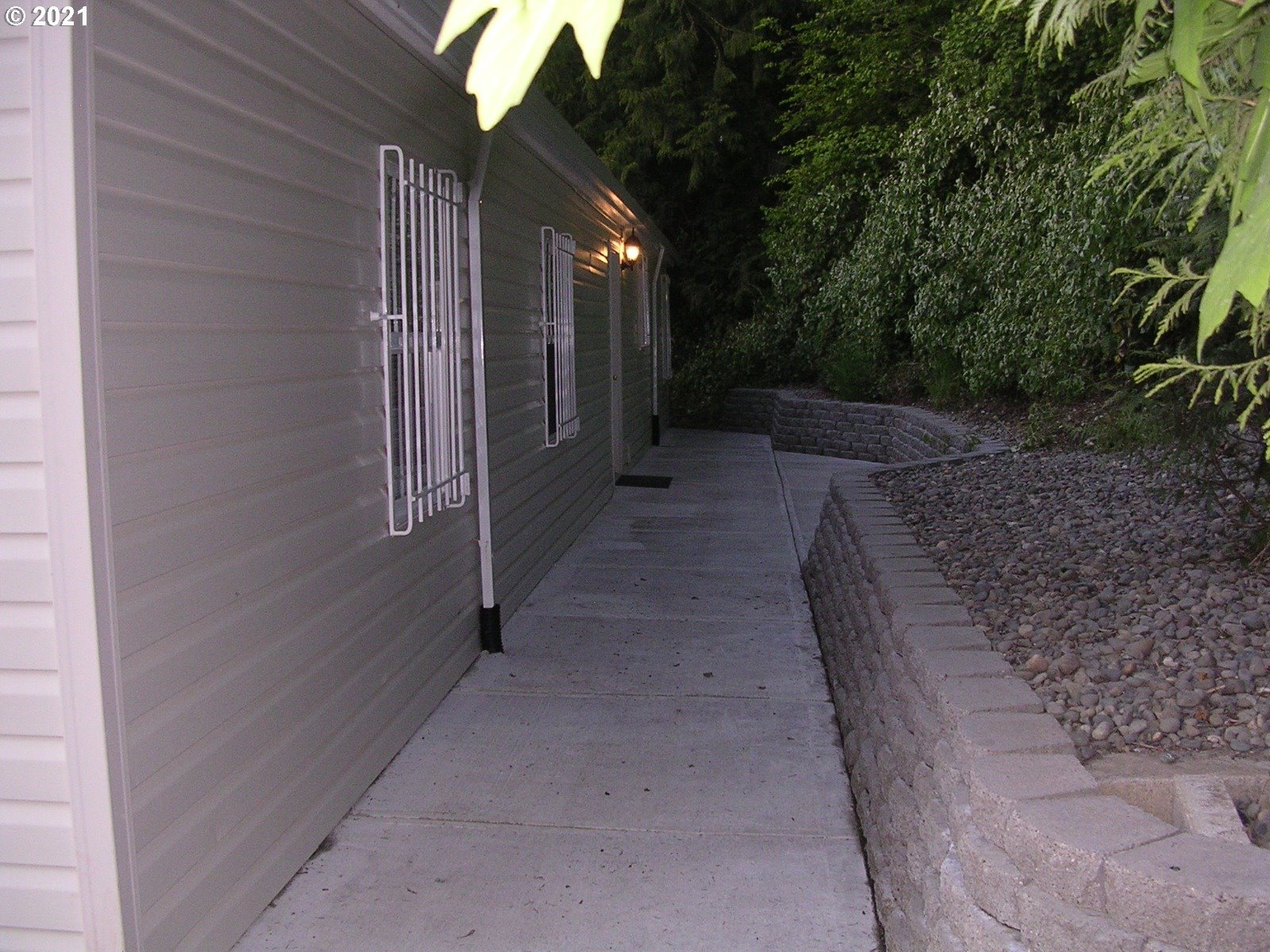 5720 Southeast Jenne Road Portland, OR 97236 - Photo 3 of 23 a view of a pathway with a house