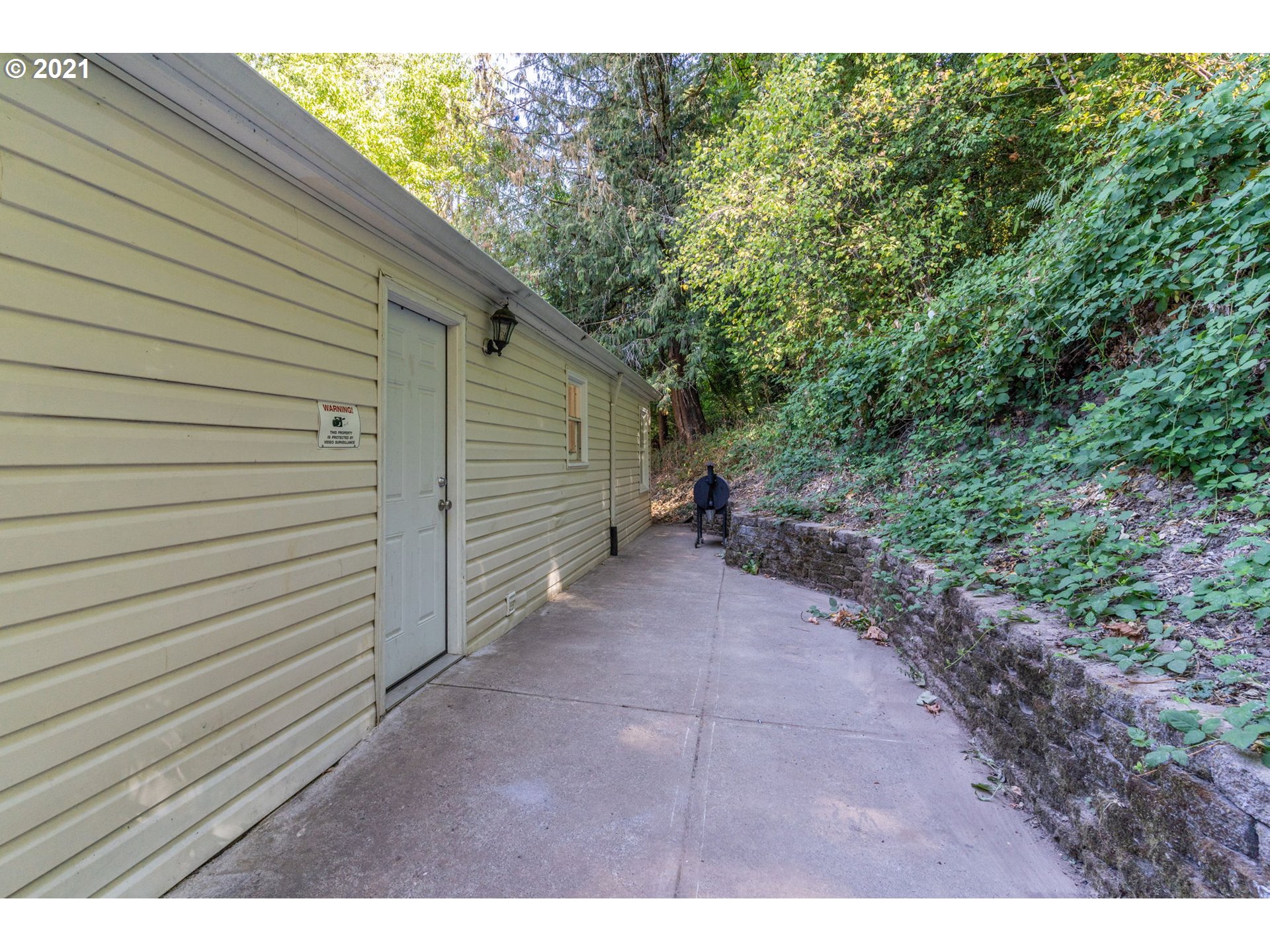 5720 Southeast Jenne Road Portland, OR 97236 - Photo 22 of 23 a view of a backyard of the house