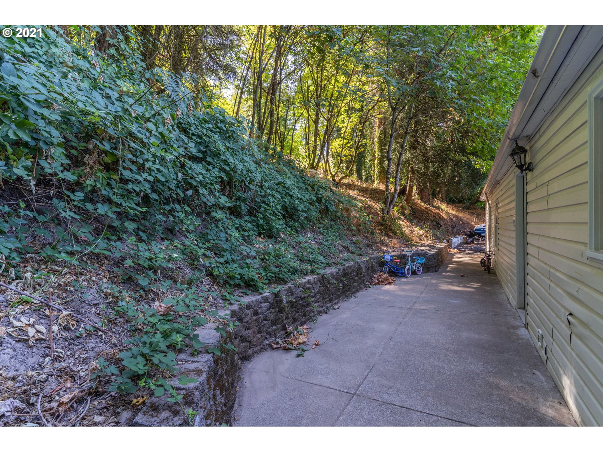 5720 Southeast Jenne Road Portland, OR 97236 - Photo 23 of 23 a view of a yard with plants and a bench
