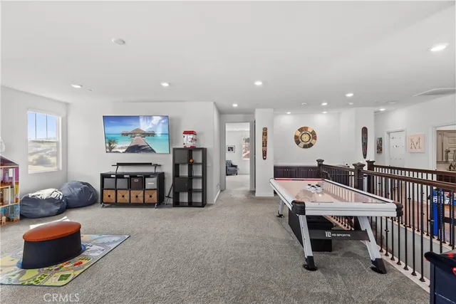 a room with furniture and a flat screen tv