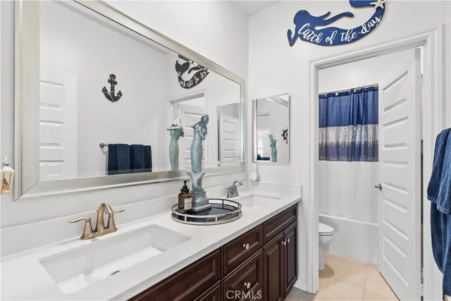 a bathroom with a sink a vanity and a mirror