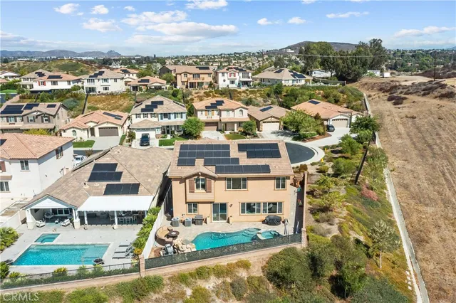 an aerial view of residential houses with outdoor space