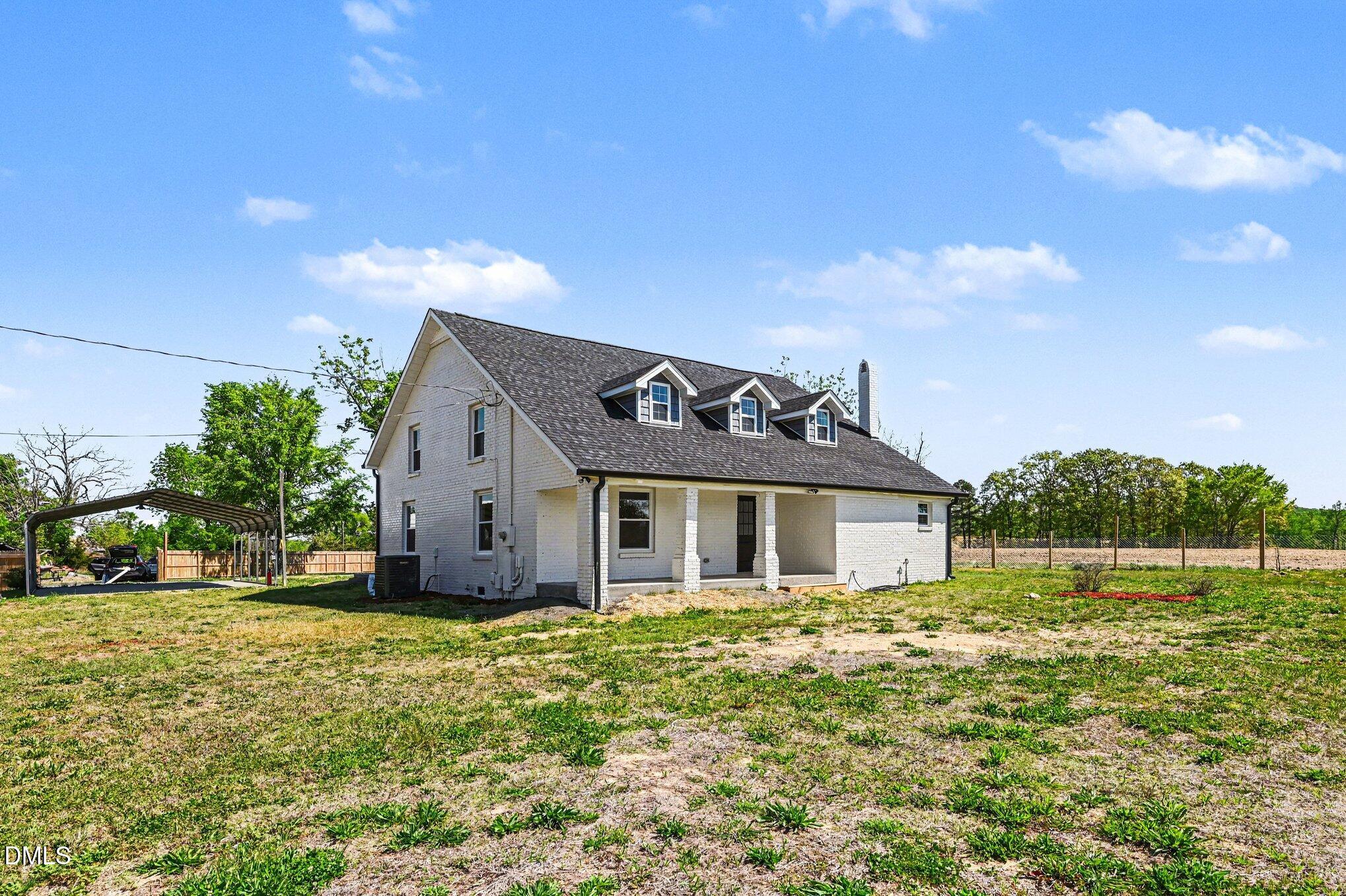 1325 Charlie Carr Road Roxboro, NC 27574 - Photo 5 of 31 a house view with a garden space