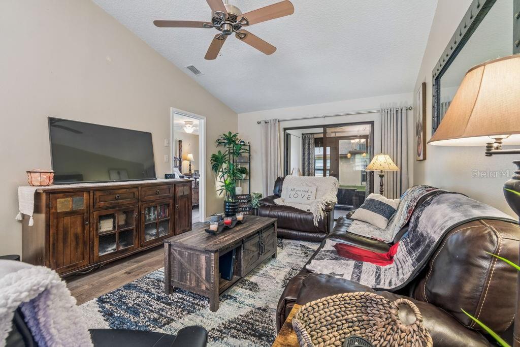 4753 Sunny Loop Holiday, FL 34690 - Photo 15 of 39 a living room with furniture and a flat screen tv