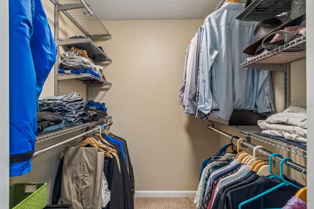 4753 Sunny Loop Holiday, FL 34690 - Photo 24 of 39 a view of walk in closet with clothes and shoes