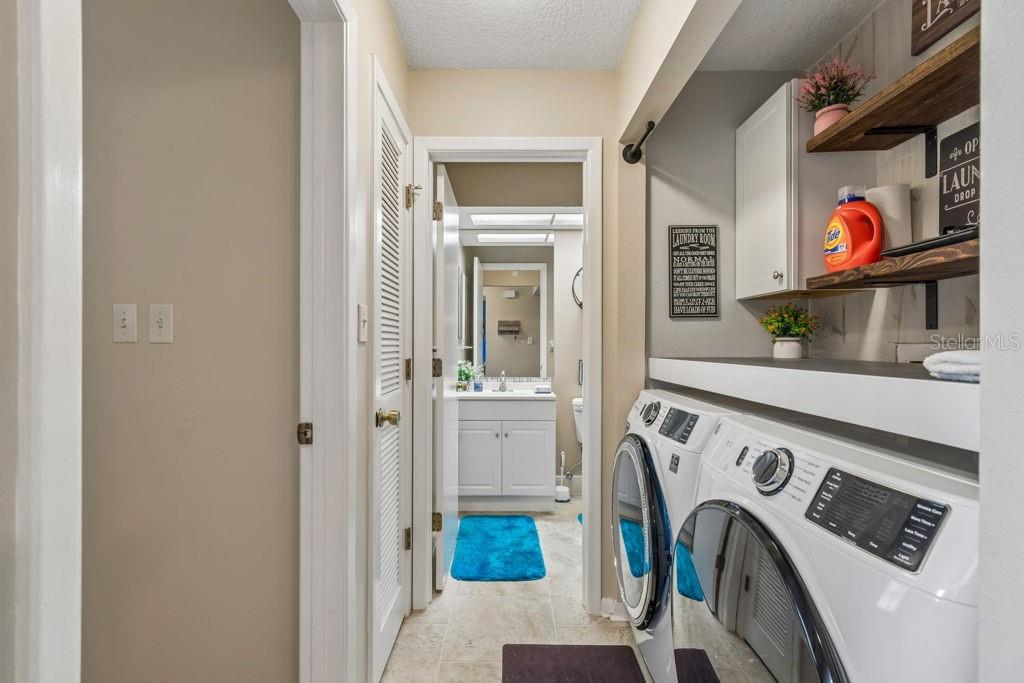 4753 Sunny Loop Holiday, FL 34690 - Photo 25 of 39 a utility room with dryer and washer