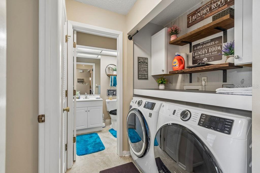 4753 Sunny Loop Holiday, FL 34690 - Photo 26 of 39 a utility room with dryer and washer