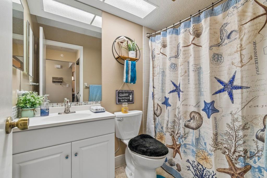 4753 Sunny Loop Holiday, FL 34690 - Photo 28 of 39 a bathroom with a sink and a mirror