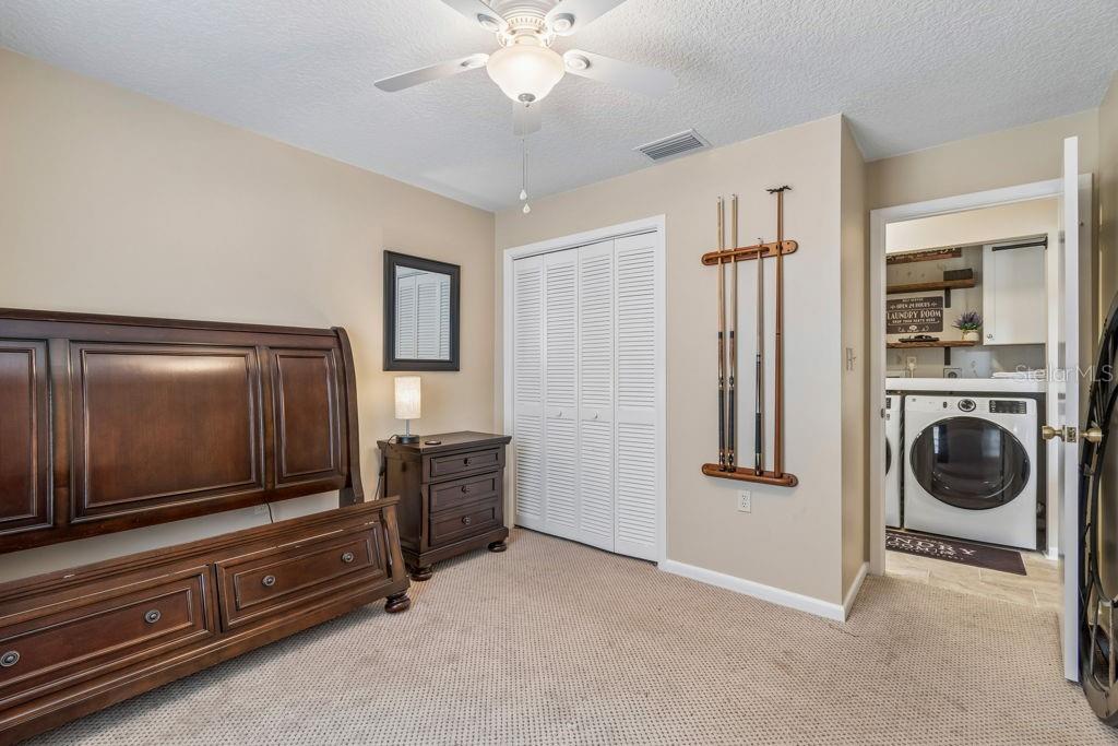 4753 Sunny Loop Holiday, FL 34690 - Photo 30 of 39 a living room with furniture and a flat screen tv