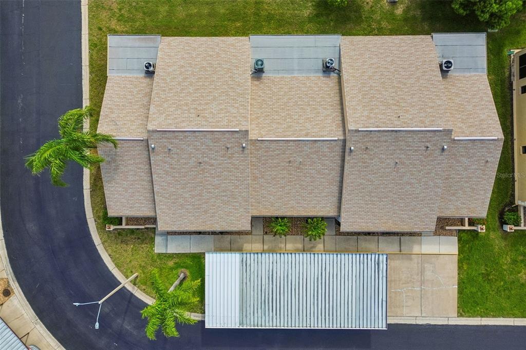 4753 Sunny Loop Holiday, FL 34690 - Photo 32 of 39 an aerial view of a house with a garden
