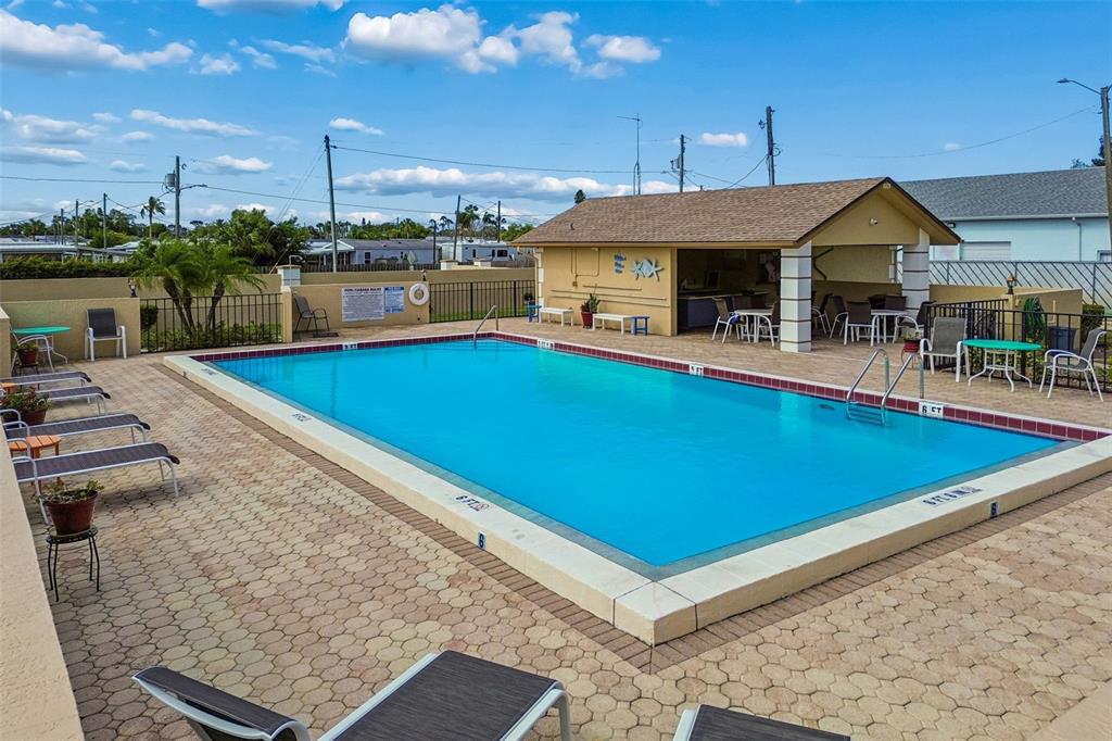 4753 Sunny Loop Holiday, FL 34690 - Photo 36 of 39 an outdoor space with swimming pool and furniture