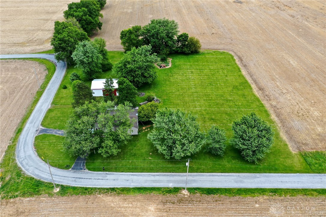 2470 Clark Run Road Xenia, OH 45385 - Photo 31 of 57 This aerial perspective showcases a tranquil countryside home nestled amidst lush green fields.