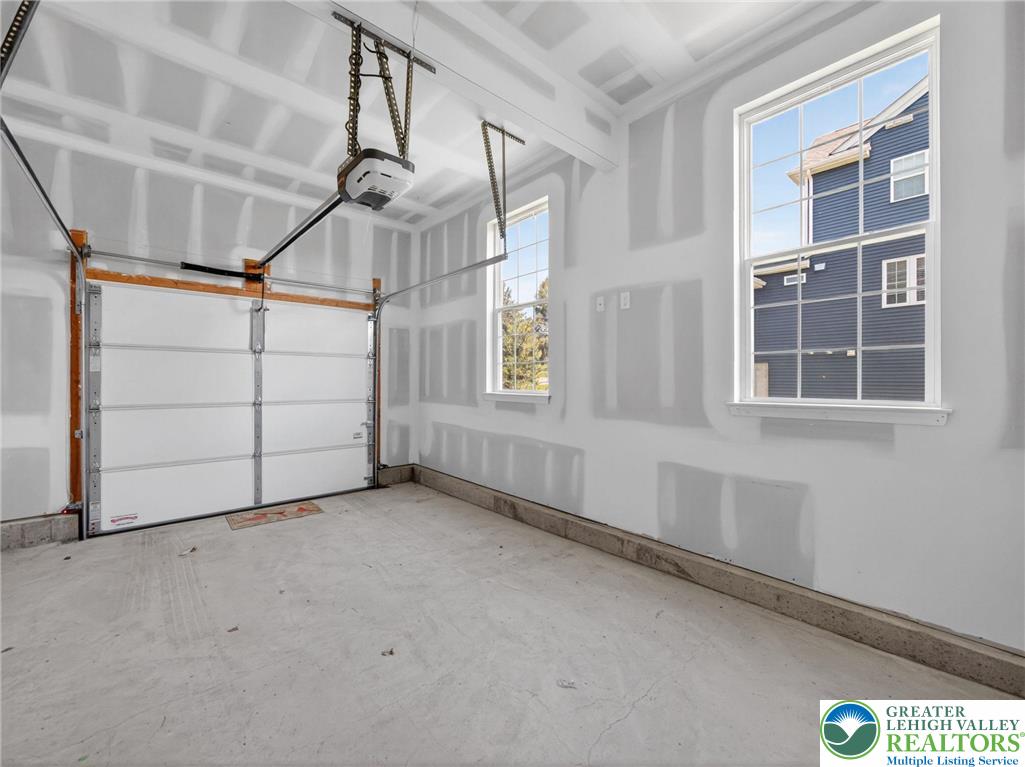 477 Newlins Road East Easton, PA 18040 - Photo 47 of 69 Single garage with windows, courtyard entrance