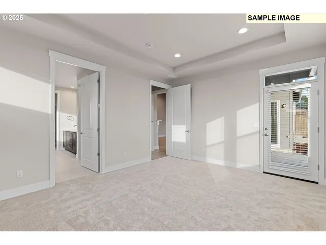 a bathroom with a granite countertop sink a mirror a vanity and shower