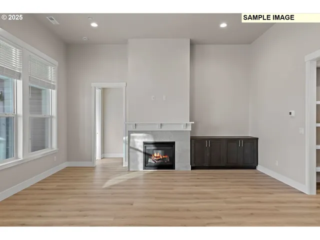 a view of kitchen with kitchen island granite countertop a sink and refrigerator