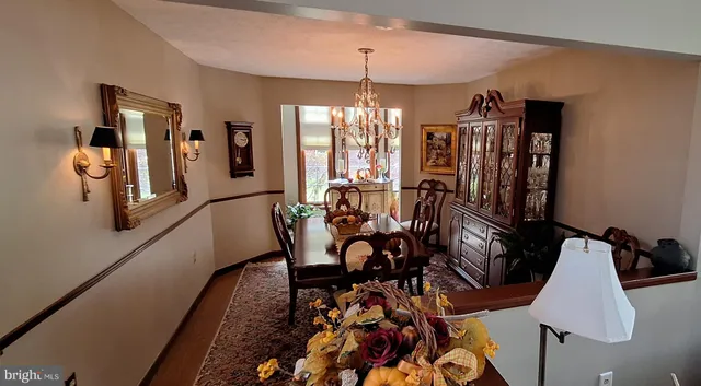 a view of a dining room with furniture and window