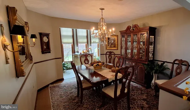 a view of a livingroom with furniture and a flat screen tv