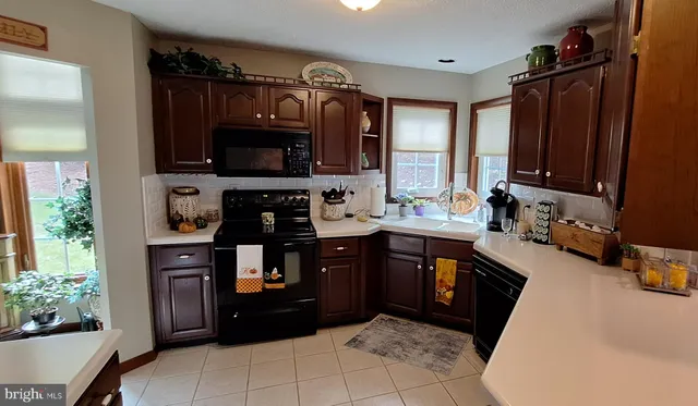 a view of a livingroom with furniture and a flat screen tv