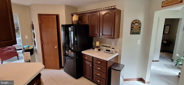 a hotel room with bed and furniture