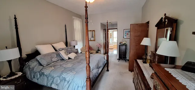 a bathroom with a bathtub and a window