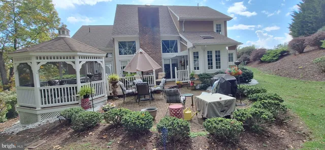 a view of a house with garden and porch