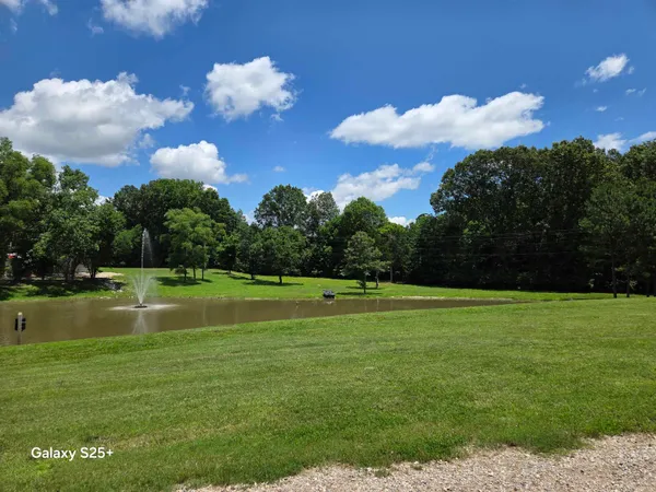 a view of a golf course with a lake