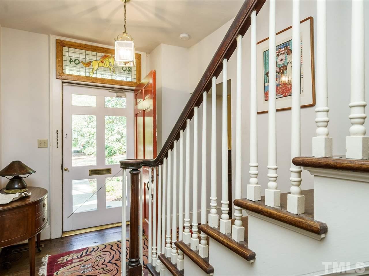 2004 Stone Street Raleigh, NC 27608 - Photo 2 of 23 a view of an entryway with wooden floor and windows