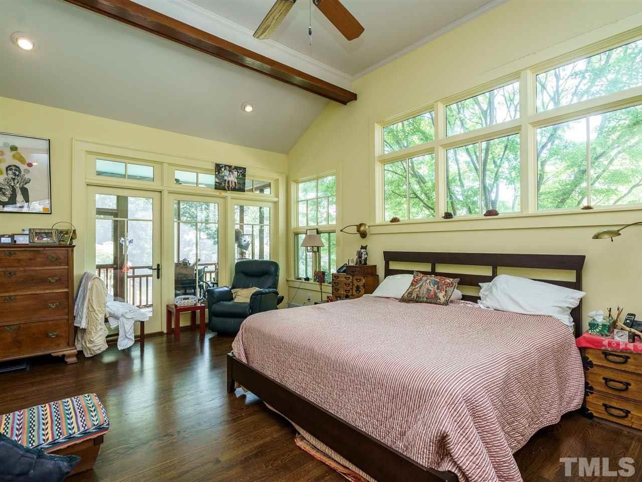 2004 Stone Street Raleigh, NC 27608 - Photo 11 of 23 a bedroom with a large bed and a large window