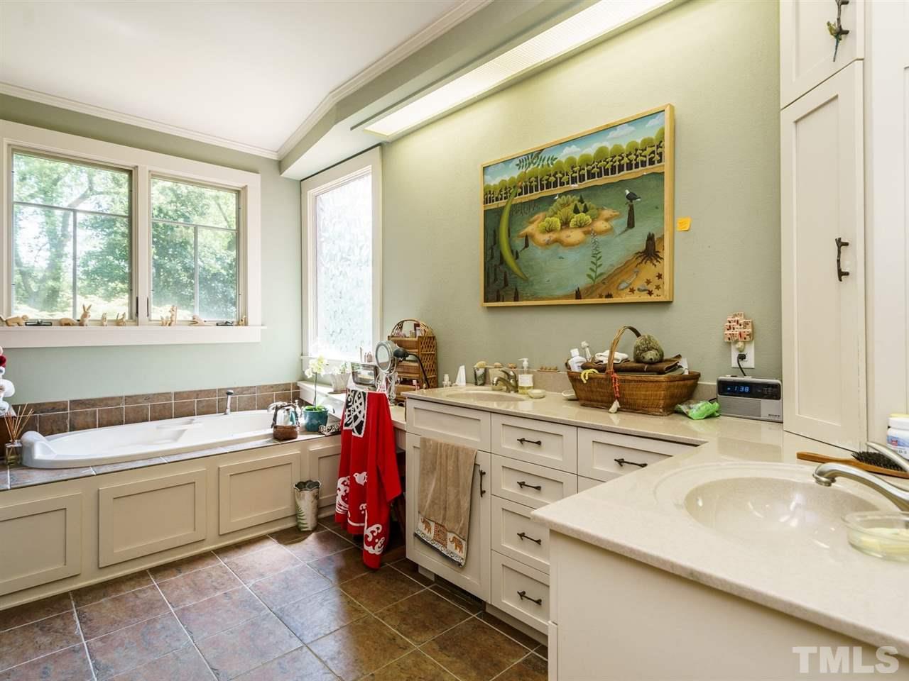2004 Stone Street Raleigh, NC 27608 - Photo 12 of 23 a bathroom with a granite countertop sink mirror and a bathtub