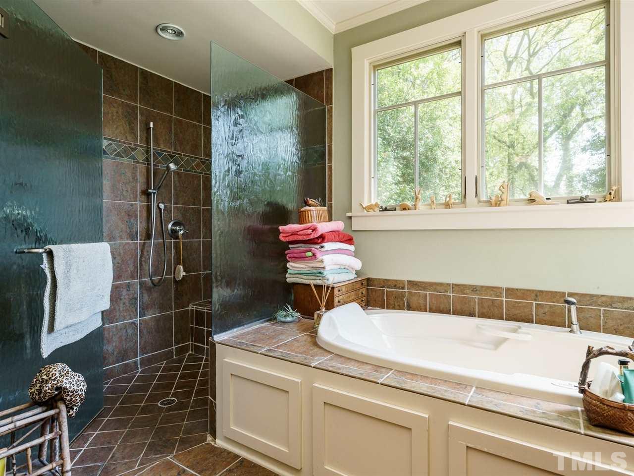 2004 Stone Street Raleigh, NC 27608 - Photo 13 of 23 a bathroom with a granite countertop bathtub sink vanity and toilet