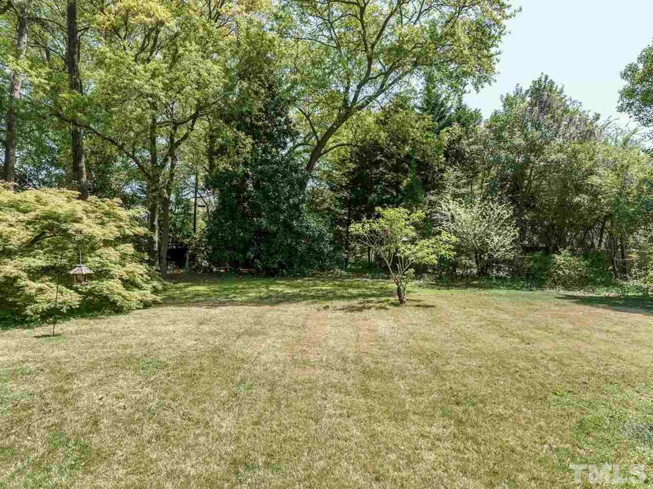 2004 Stone Street Raleigh, NC 27608 - Photo 20 of 23 a view of a yard with trees