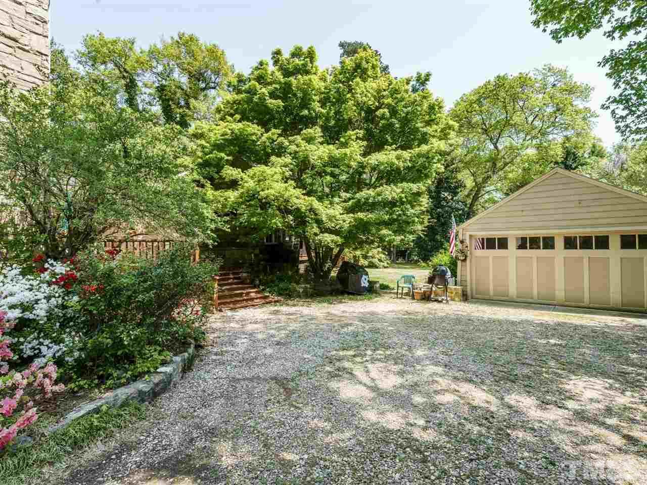 2004 Stone Street Raleigh, NC 27608 - Photo 22 of 23 a front view of a house with a yard and trees