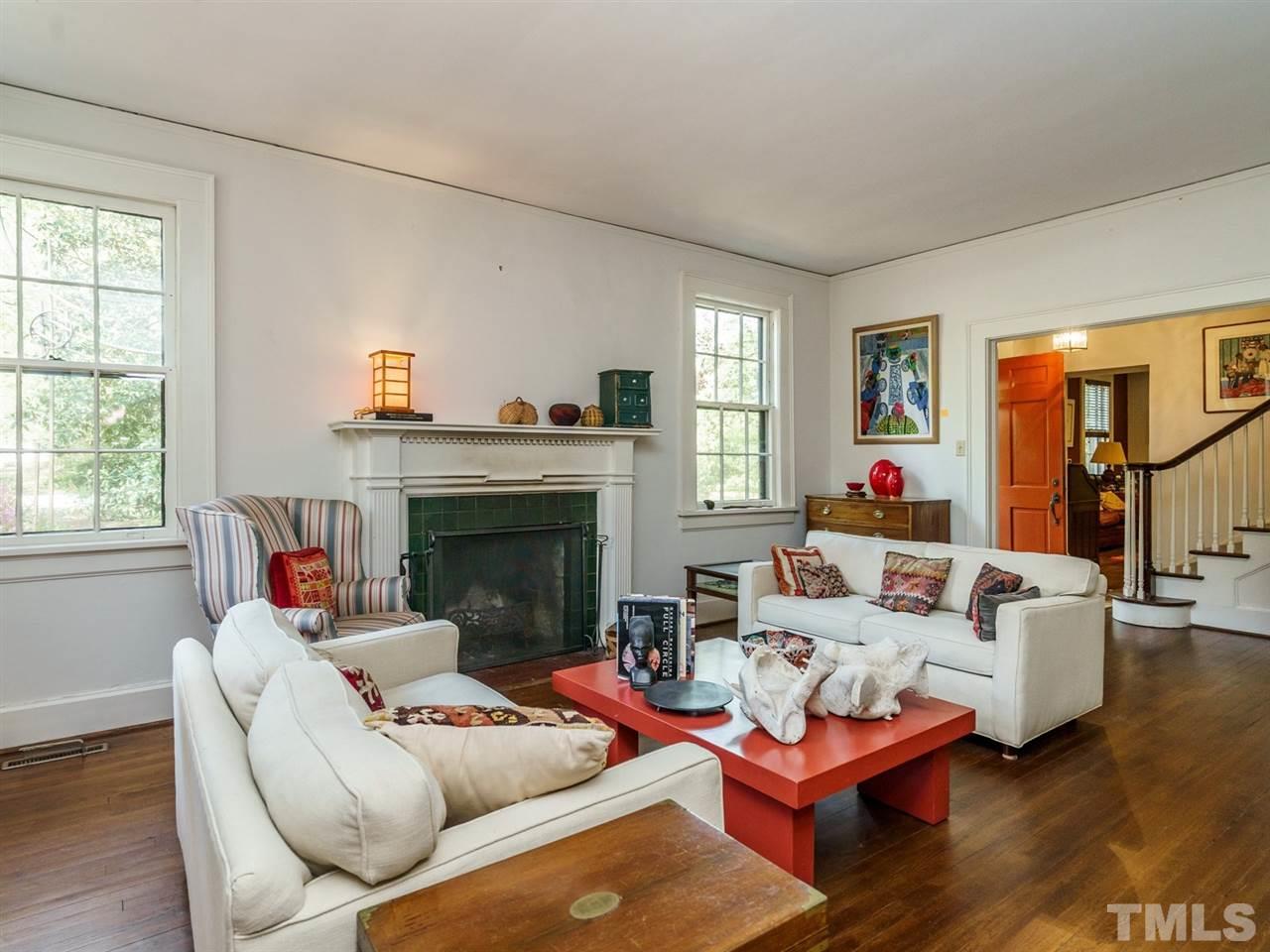 2004 Stone Street Raleigh, NC 27608 - Photo 4 of 23 a living room with furniture and a fireplace