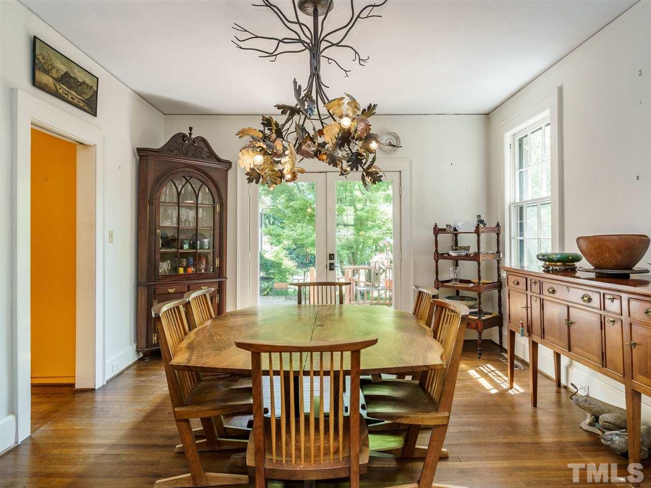 2004 Stone Street Raleigh, NC 27608 - Photo 5 of 23 a view of a dining room with furniture window and wooden floor