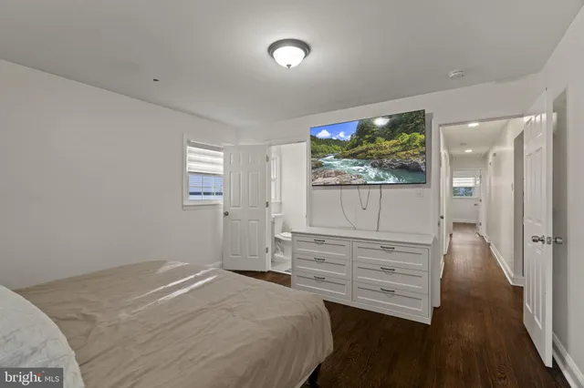 a bathroom with a sink toilet and a mirror