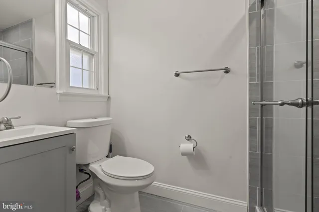 a bathroom with a glass shower door