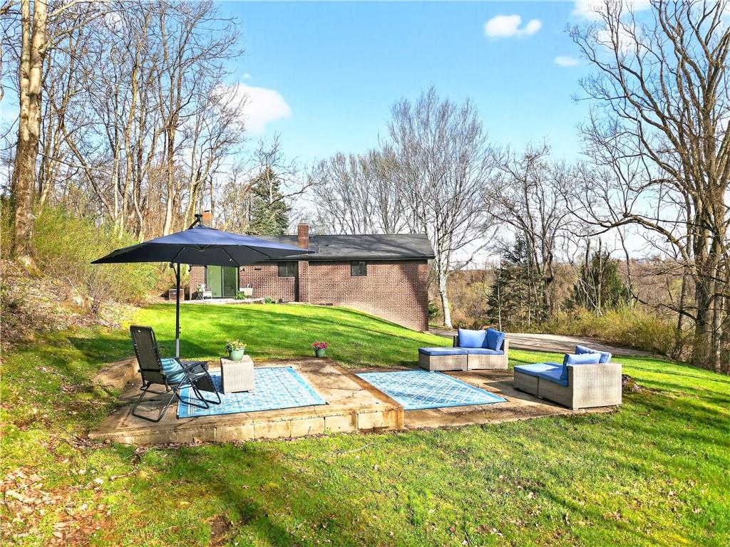 224 Salem Church Road Rostraver Township, PA 15012 - Photo 13 of 48 a front view of a house with a yard table and chairs