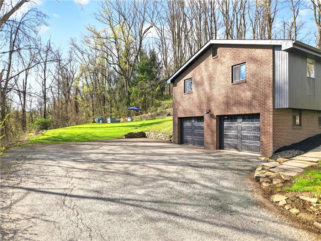 224 Salem Church Road Rostraver Township, PA 15012 - Photo 2 of 48 a front view of a house with a yard and garage