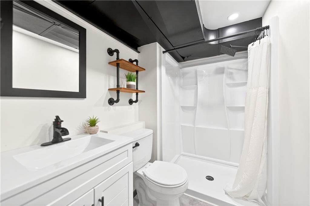 224 Salem Church Road Rostraver Township, PA 15012 - Photo 42 of 48 a bathroom with a sink a toilet and shower