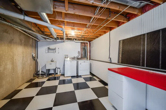 a view of a room with a black and white checkered floor