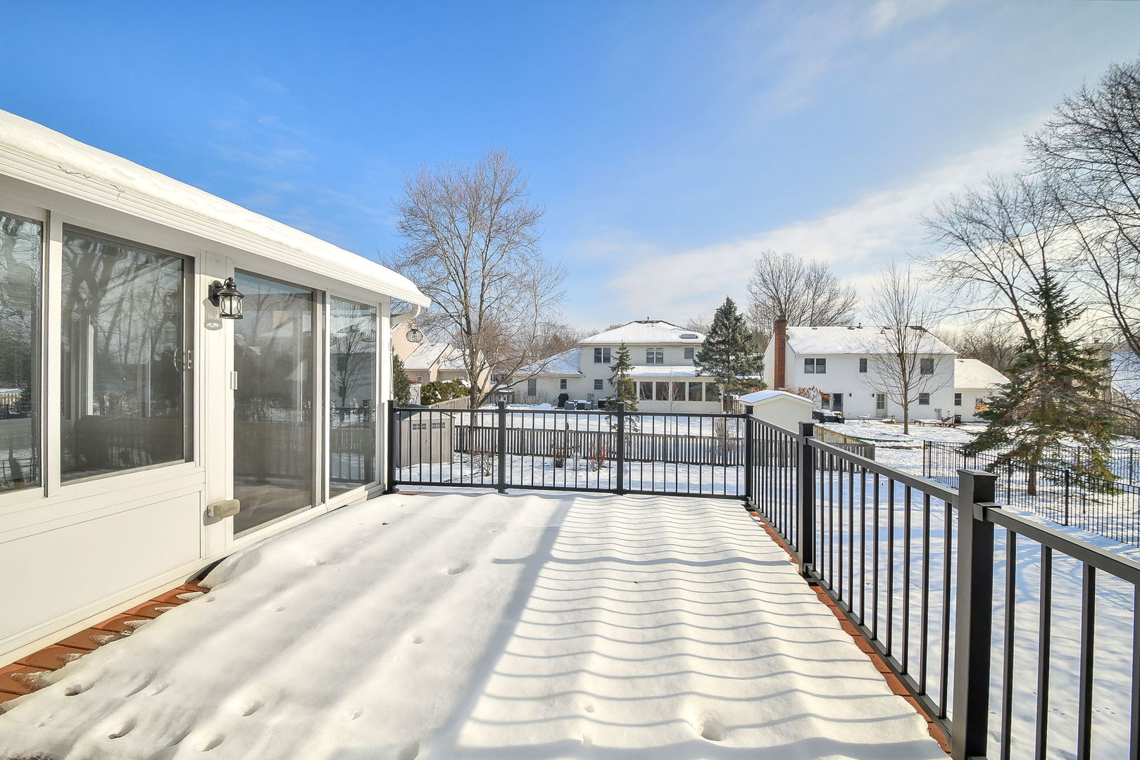 389 Colonial Circle Geneva, IL 60134 - Photo 22 of 25 a view of a balcony with wooden floor