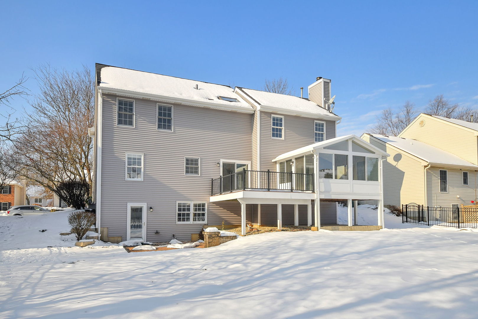 389 Colonial Circle Geneva, IL 60134 - Photo 23 of 25 a front view of a building with a road